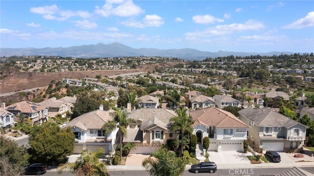 drone / aerial view with a mountain view and a residential view