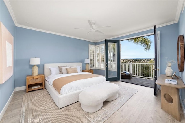 bedroom featuring access to exterior, crown molding, light wood-style floors, and baseboards