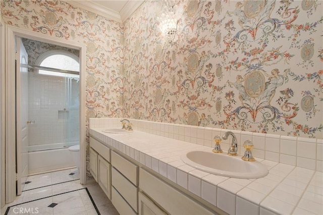 bathroom with vanity, shower / bath combination with glass door, and ornamental molding