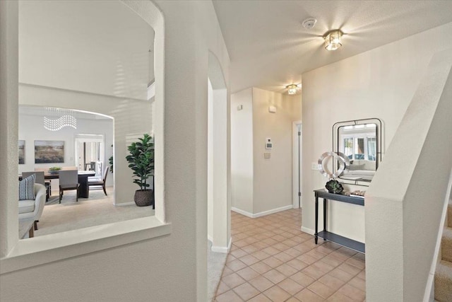 hall with light tile patterned flooring