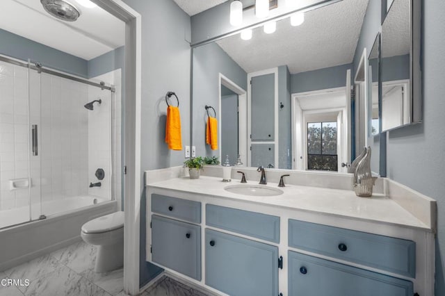 full bathroom with vanity, combined bath / shower with glass door, a textured ceiling, and toilet