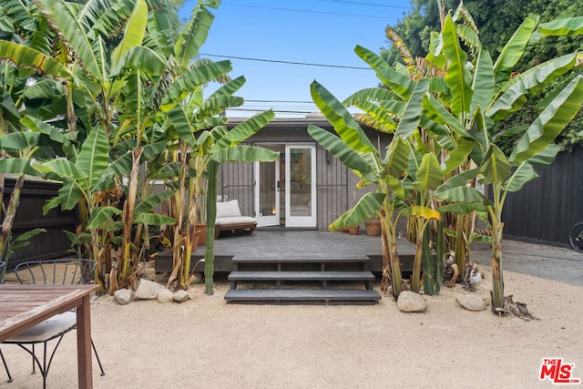 property entrance with a deck