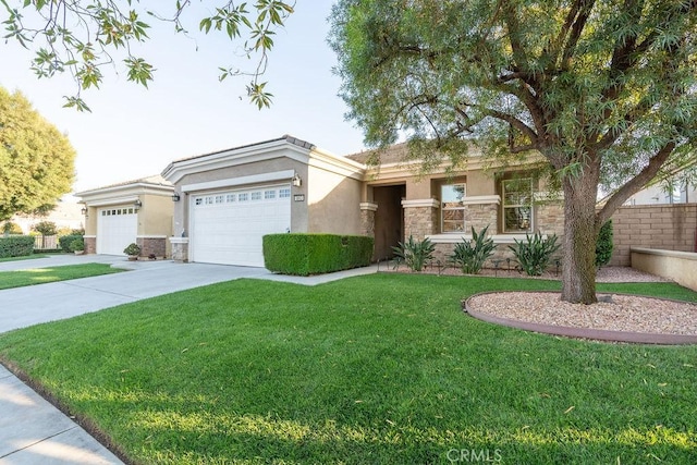 view of front of property with a garage and a front lawn