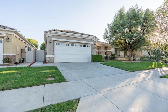 view of front of home featuring a front yard and a garage