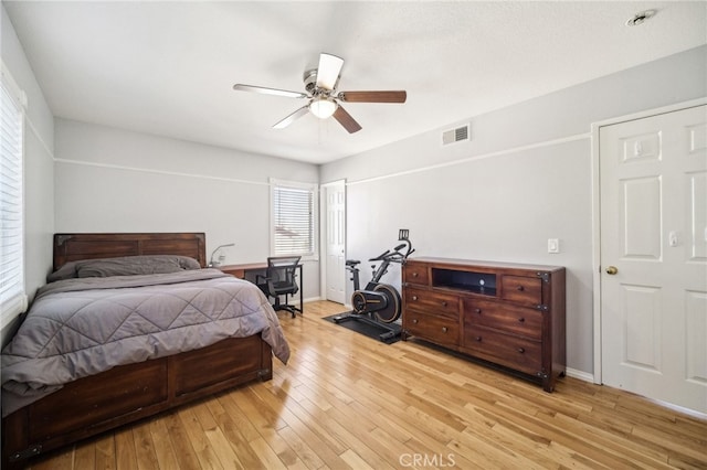 bedroom with light wood-type flooring and ceiling fan