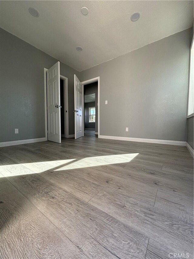 spare room featuring hardwood / wood-style floors