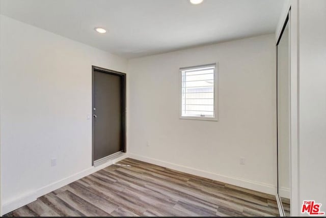 unfurnished bedroom with light hardwood / wood-style flooring