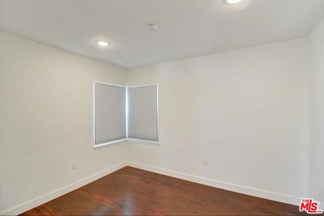 empty room featuring dark hardwood / wood-style floors