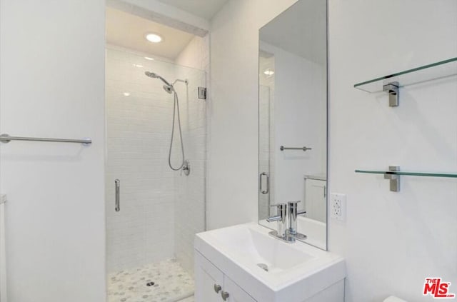 bathroom featuring vanity and walk in shower