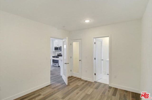 empty room with light wood-type flooring