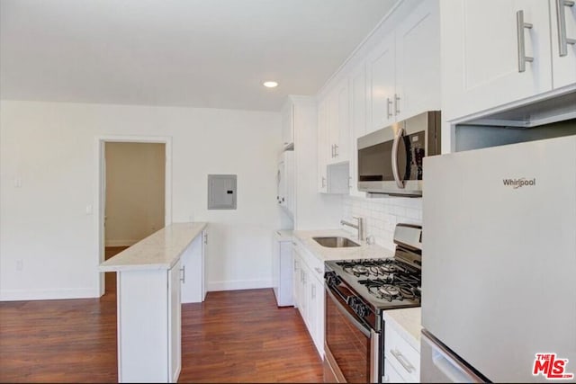 kitchen with white cabinetry, stainless steel appliances, dark hardwood / wood-style flooring, and sink