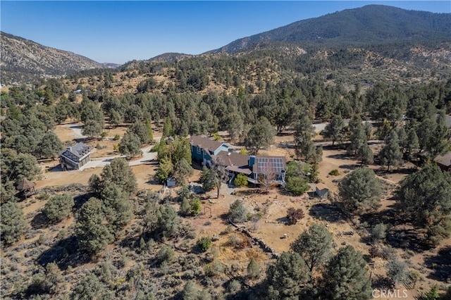 birds eye view of property with a mountain view