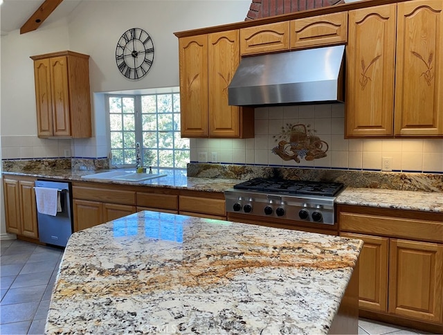 kitchen featuring appliances with stainless steel finishes, sink, light stone counters, beam ceiling, and extractor fan