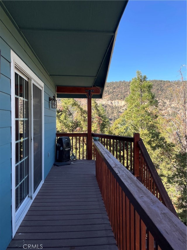 wooden deck featuring grilling area