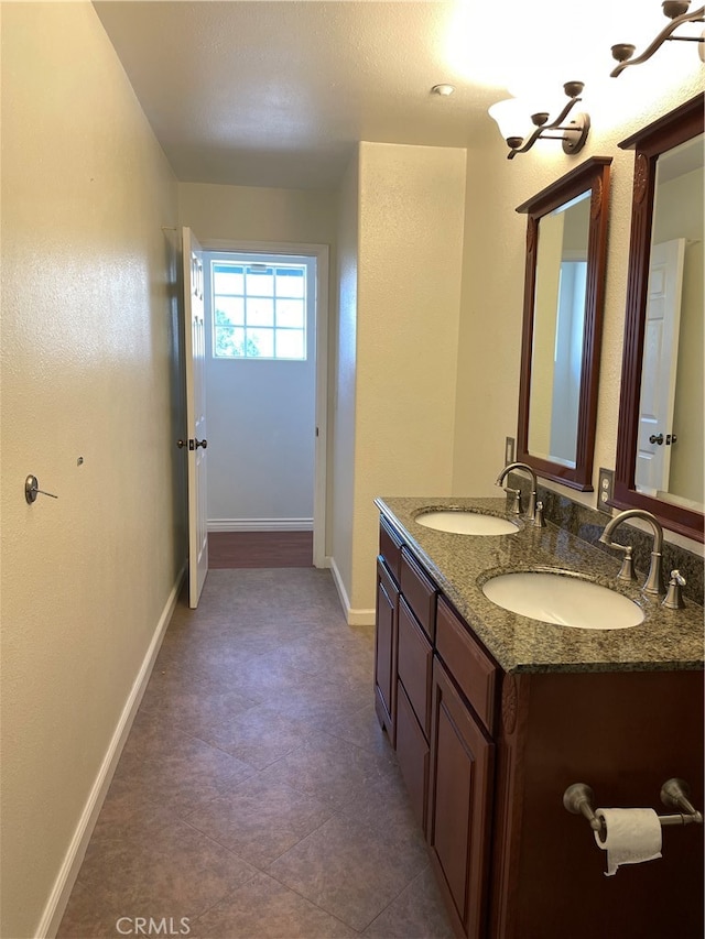 bathroom with vanity and tile patterned flooring