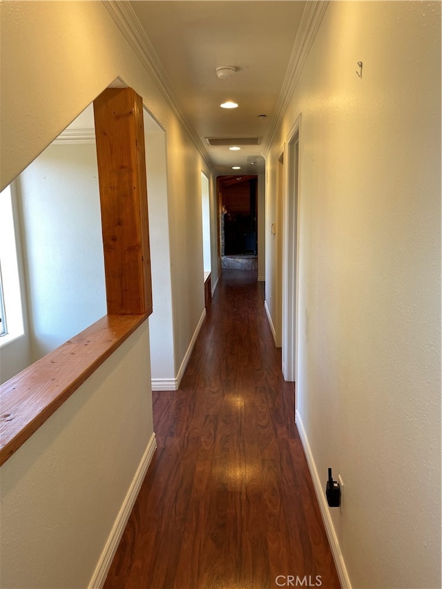 hall with ornamental molding and dark hardwood / wood-style flooring