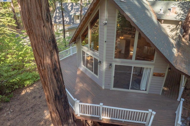 view of side of home featuring a wooden deck