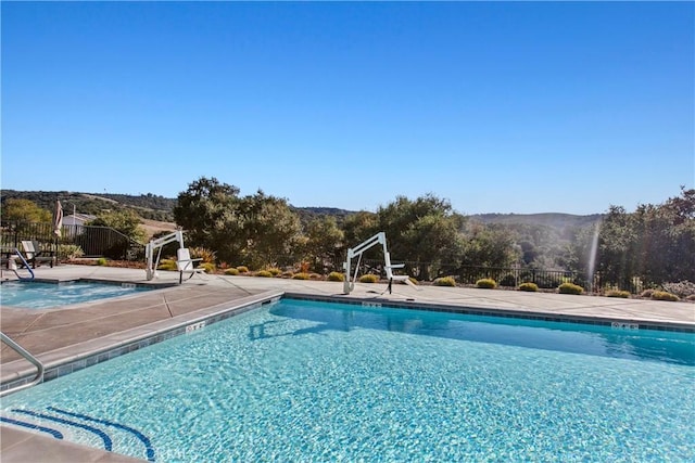 view of pool featuring a mountain view