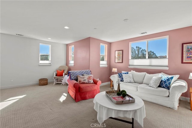 living room featuring light carpet