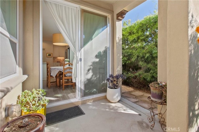 doorway to outside featuring concrete floors