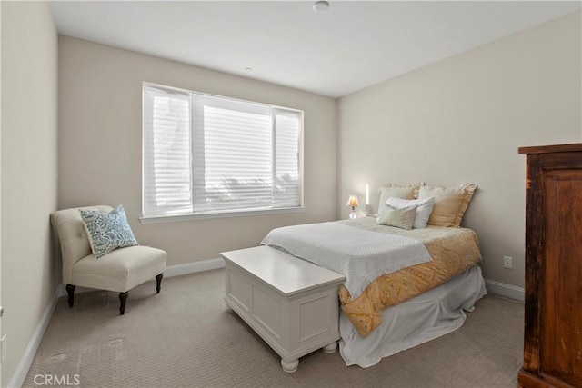 bedroom with light colored carpet