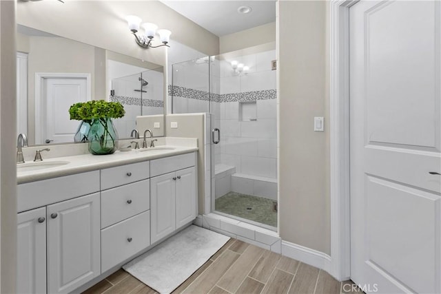 bathroom featuring vanity and an enclosed shower