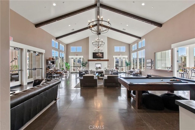 playroom featuring beamed ceiling, high vaulted ceiling, an inviting chandelier, and french doors