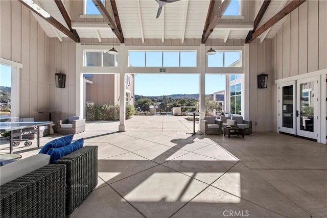 view of patio / terrace with a mountain view, outdoor lounge area, french doors, and ceiling fan