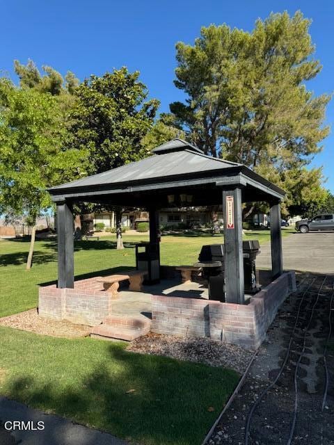 view of community featuring a gazebo and a yard