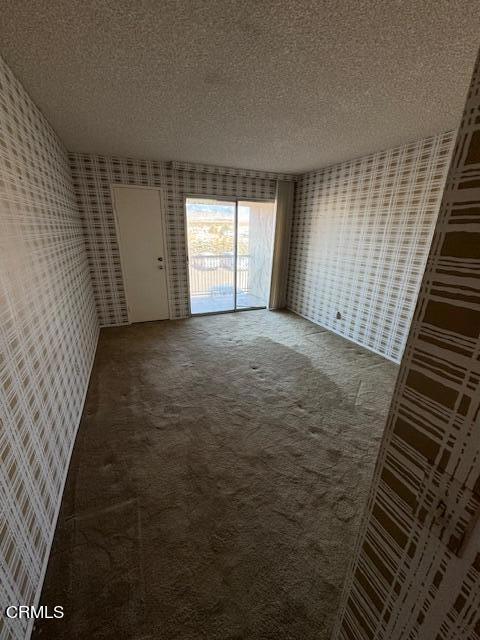 spare room featuring a textured ceiling