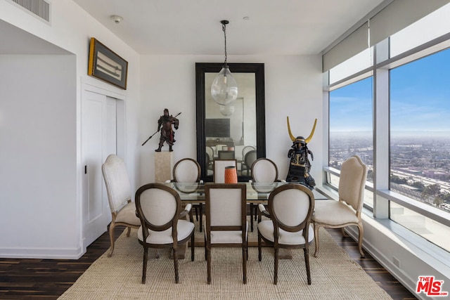 dining space with dark wood-type flooring