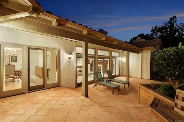 view of patio terrace at dusk