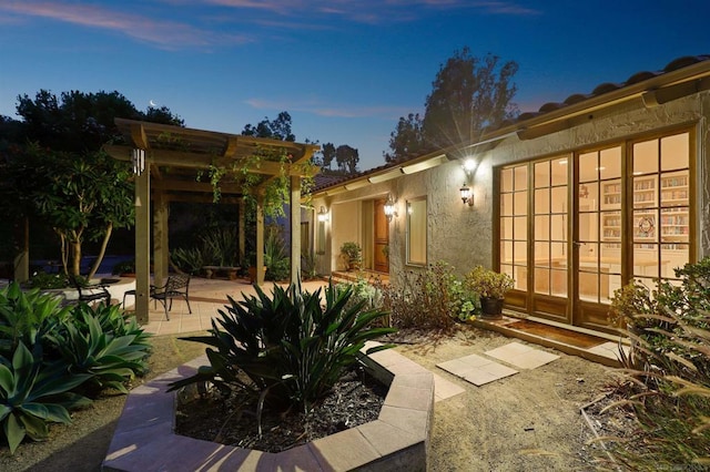 view of patio terrace at dusk