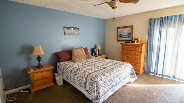 carpeted bedroom with a textured ceiling and ceiling fan