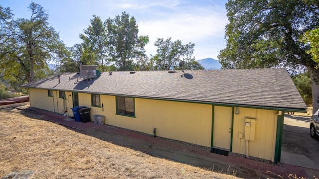 back of property with a mountain view