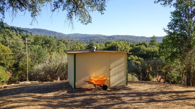 view of outbuilding featuring a mountain view