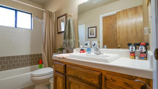 full bathroom featuring vanity, toilet, and shower / bath combo