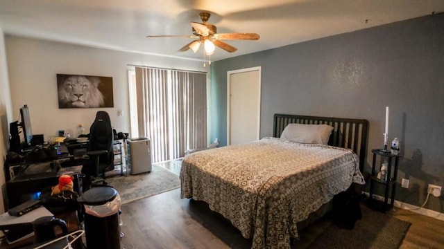 bedroom with wood-type flooring and ceiling fan