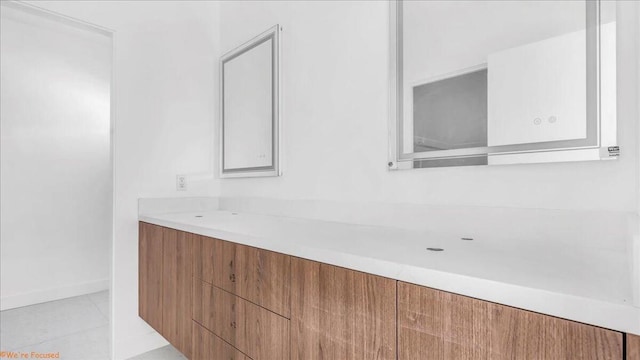 bathroom with tile patterned floors