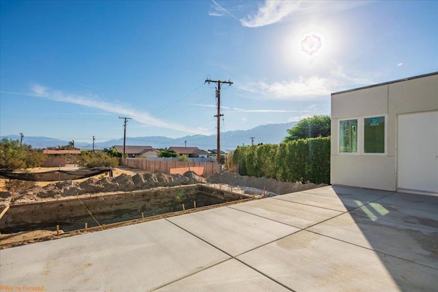 view of patio with a mountain view