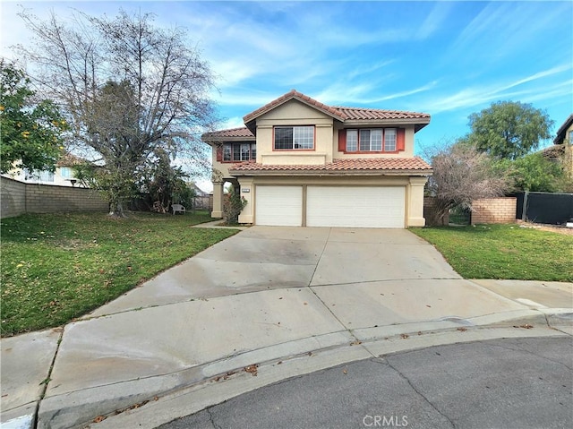 view of front of house with a front yard, a tile roof, fence, and stucco siding