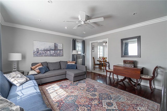 living room featuring crown molding, ceiling fan, and dark hardwood / wood-style flooring