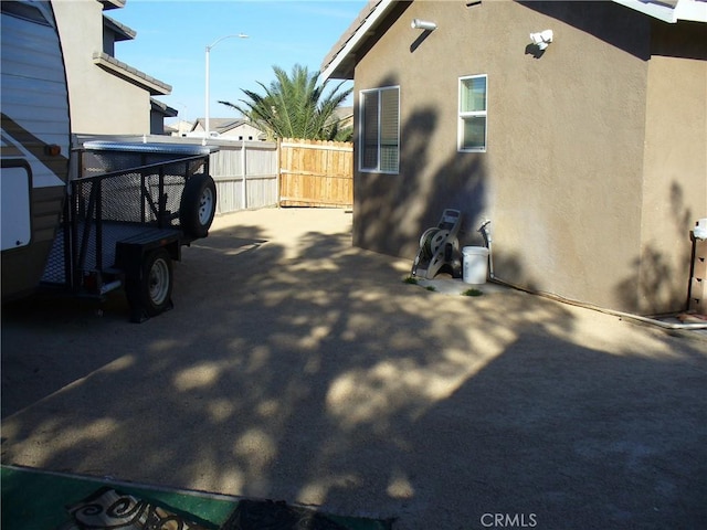 view of side of home featuring a patio area