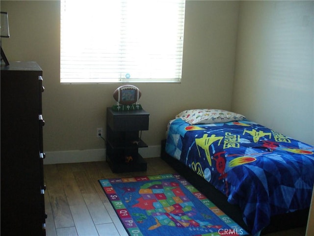 bedroom featuring hardwood / wood-style flooring