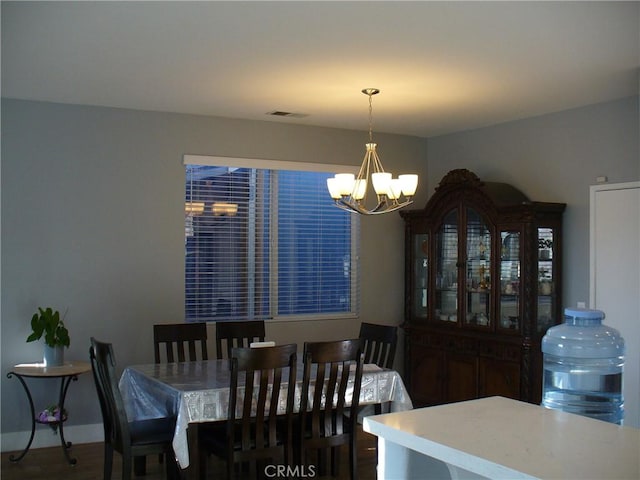 dining area with a notable chandelier