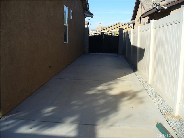 view of side of property with a patio