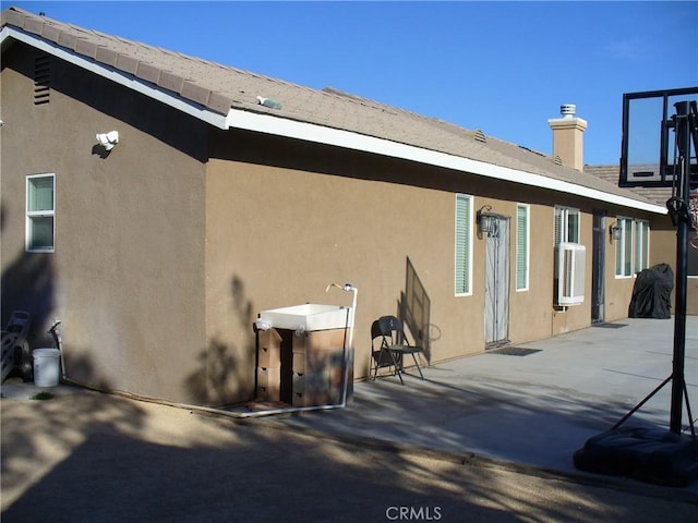 view of home's exterior featuring a patio area