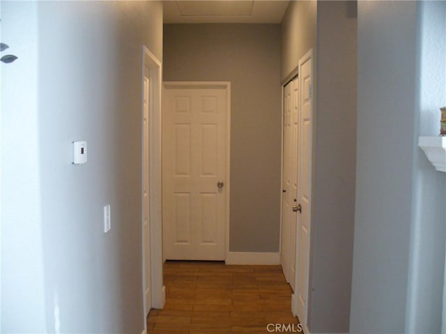 hallway with light wood-type flooring