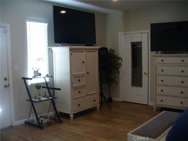 bedroom with hardwood / wood-style flooring