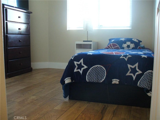 bedroom featuring wood-type flooring